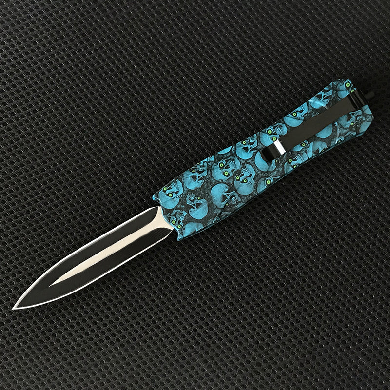Blue floral patterned EDC knife with blade extended side view