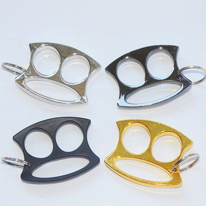 Four two-hole pocket EDC knuckle dusters in Silver, Black, Light black and Golden arranged on a white background.