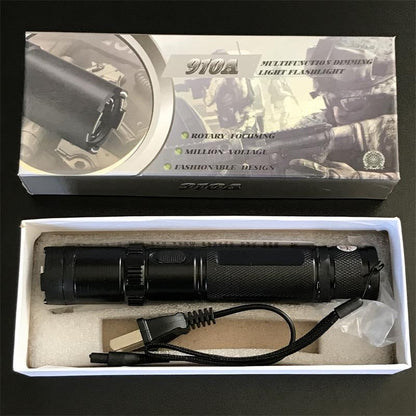 Black 910A flashlight-style unit displayed in the open retail box with wall charger and wrist strap in the tray