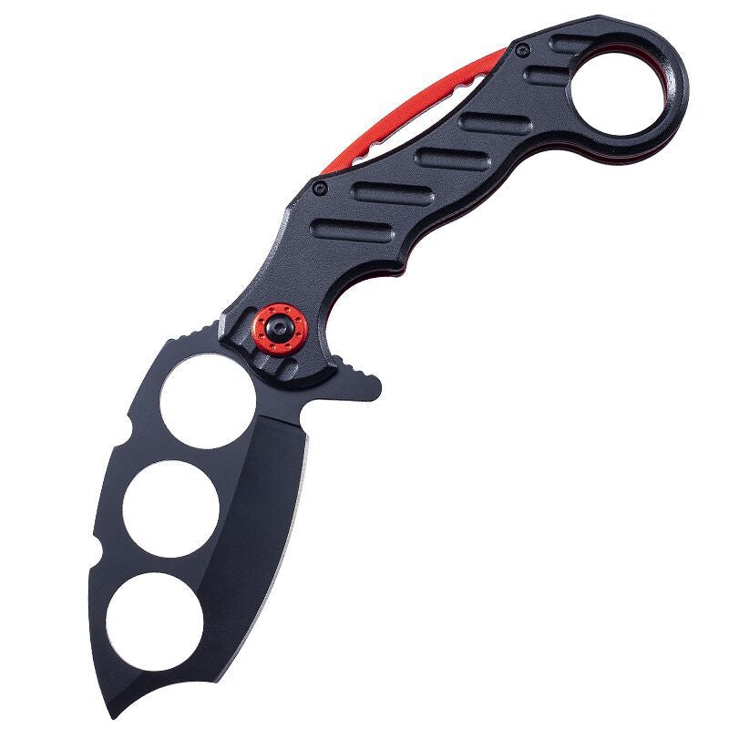 Black folding knuckle knife with red accents on clean white background