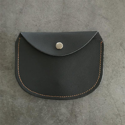 Closed black leather knuckle dusters case with the curved flap over a silver snap and orange stitching