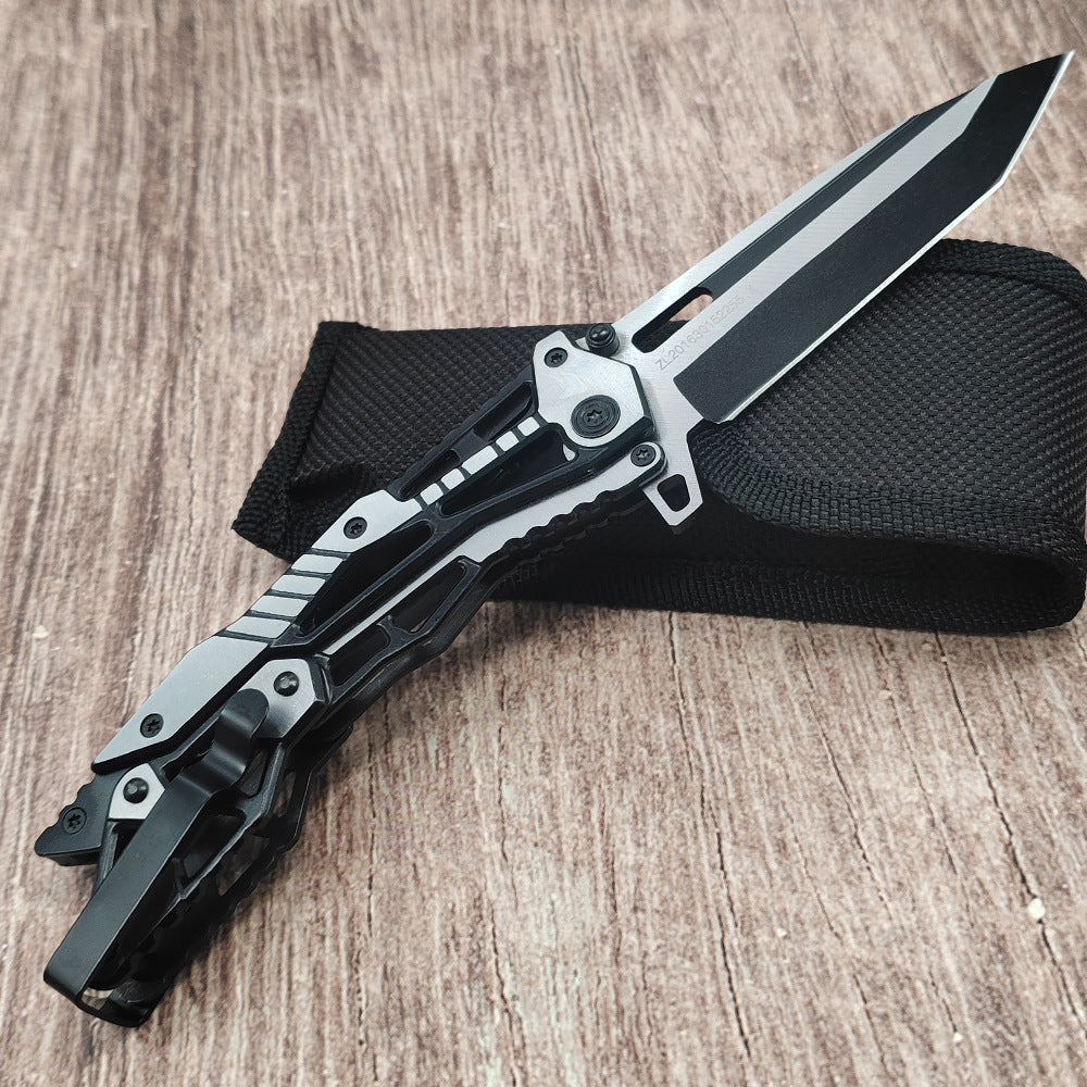 Black and silver all-steel mechanical folding knife on wood surface with black pouch