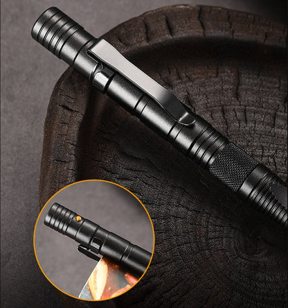A black tactical pen resting diagonally on a dark textured surface, showing the flat pocket clip, ridged barrel segments and a knurled grip near the lower end, with an inset close-up of the top end and its small orange button.