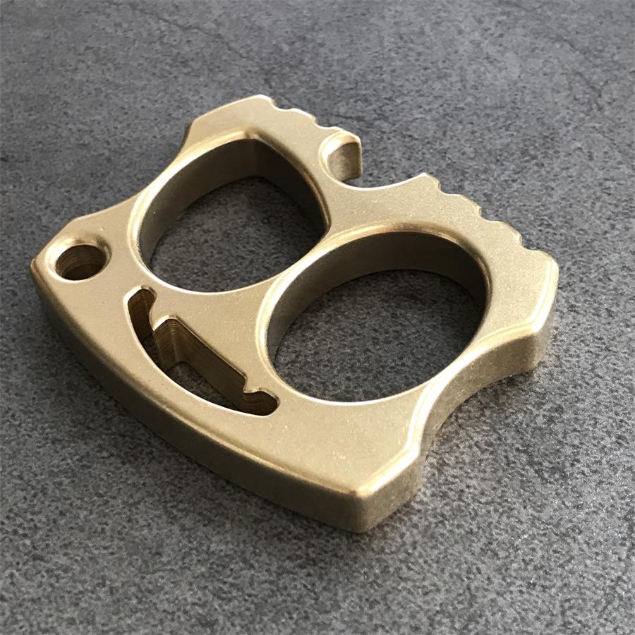 Brass two-hole knuckle angled with smile cutout and serrated edge on stone