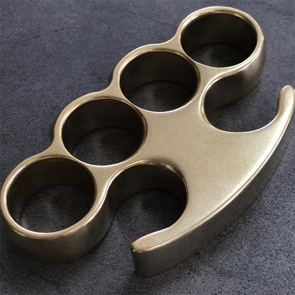 Close-up of the claw tip and upper curve on the brass knuckle duster