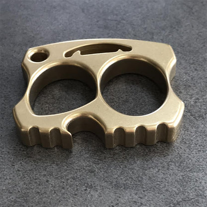 Brass knuckle top view with curved slot and segmented bottom teeth