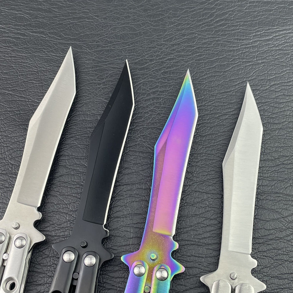 Close-up of four unsharpened trainer blades in silver black rainbow and etched finishes