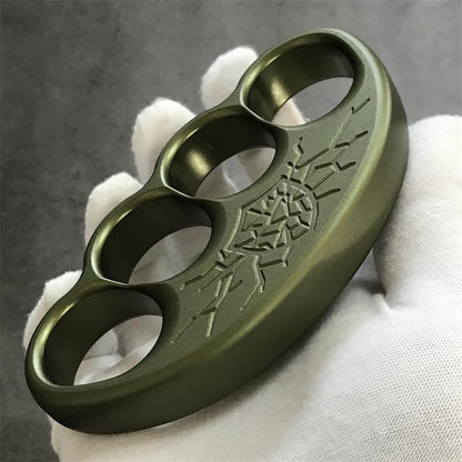 Side wall and chamfered edge detail of olive aluminum knuckle duster