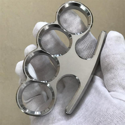 White-gloved fist presents the 304 stainless steel classic knuckle duster toward the camera.