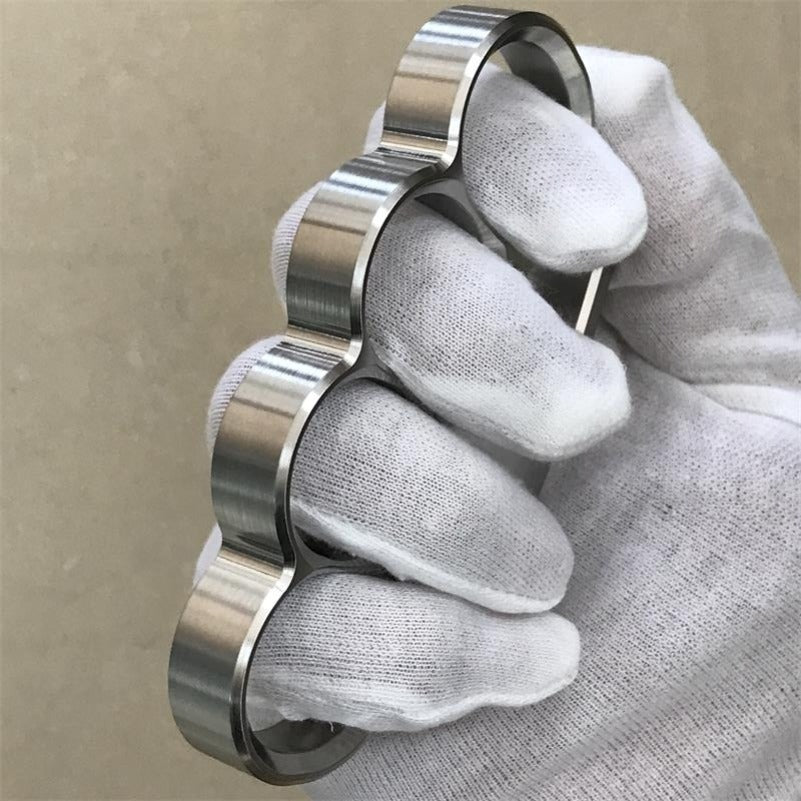 White-gloved fist wears the 304 stainless steel classic knuckle duster in a side pose.