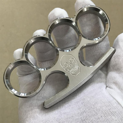 White-gloved hand displays the 304 stainless steel classic knuckle duster turned sideways.