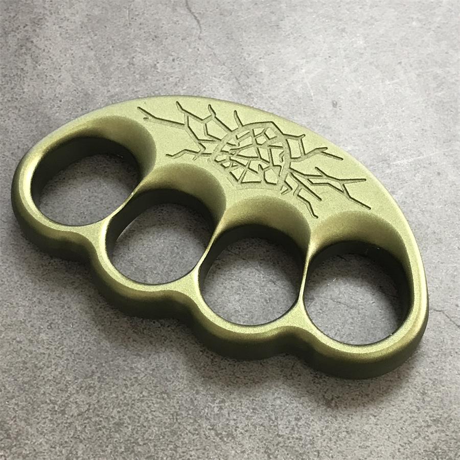 Close-up of laser-engraved cracked crest and scalloped edge on olive duster