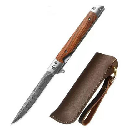 Open folding knife with a slim Damascus-pattern drop-point blade and striped wood handle beside a brown leather sheath with brass ring, on a white background