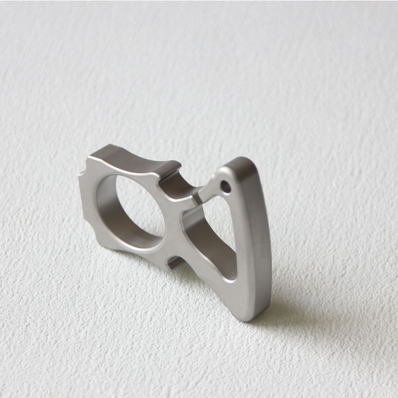 Side-lying view of the stainless steel single-hole bottle opener duster.