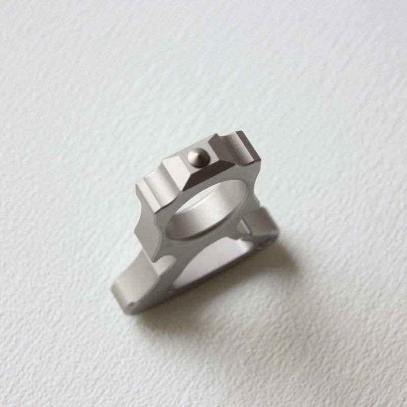 Top-down view of the stainless steel single-hole bottle opener duster.
