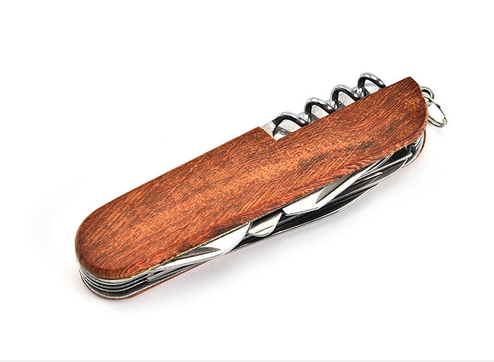 Closed folding multi-tool with dark reddish-brown wood-grain handle and the corkscrew peeking past the end