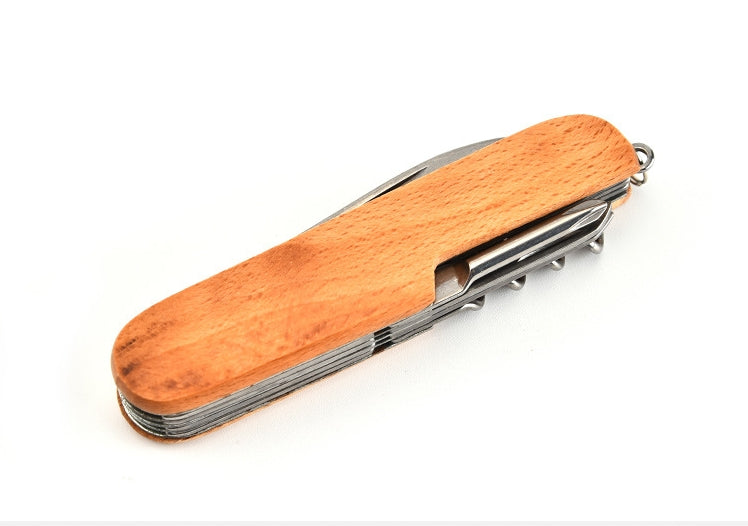 Closed folding multi-tool with light natural wood-grain handle and folded tools stacked inside the frame