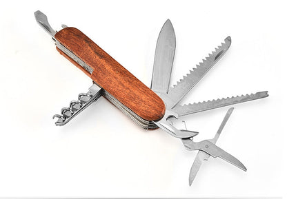 Folding multi-tool with grained handle fanned open showing saw blades, scissors and the bottle opener end