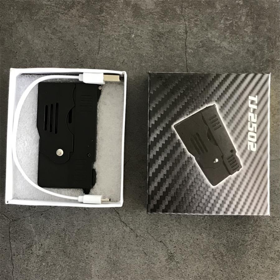 Package set with the folded stun gun and a white USB cable in a foam-lined box beside the printed retail box