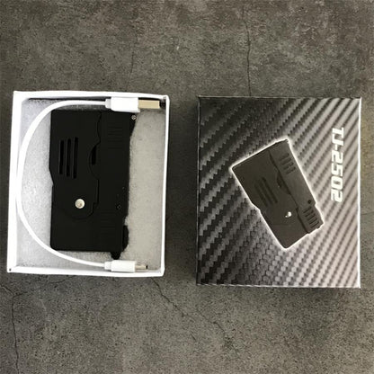 Package set with the folded stun gun and a white USB cable in a foam-lined box beside the printed retail box