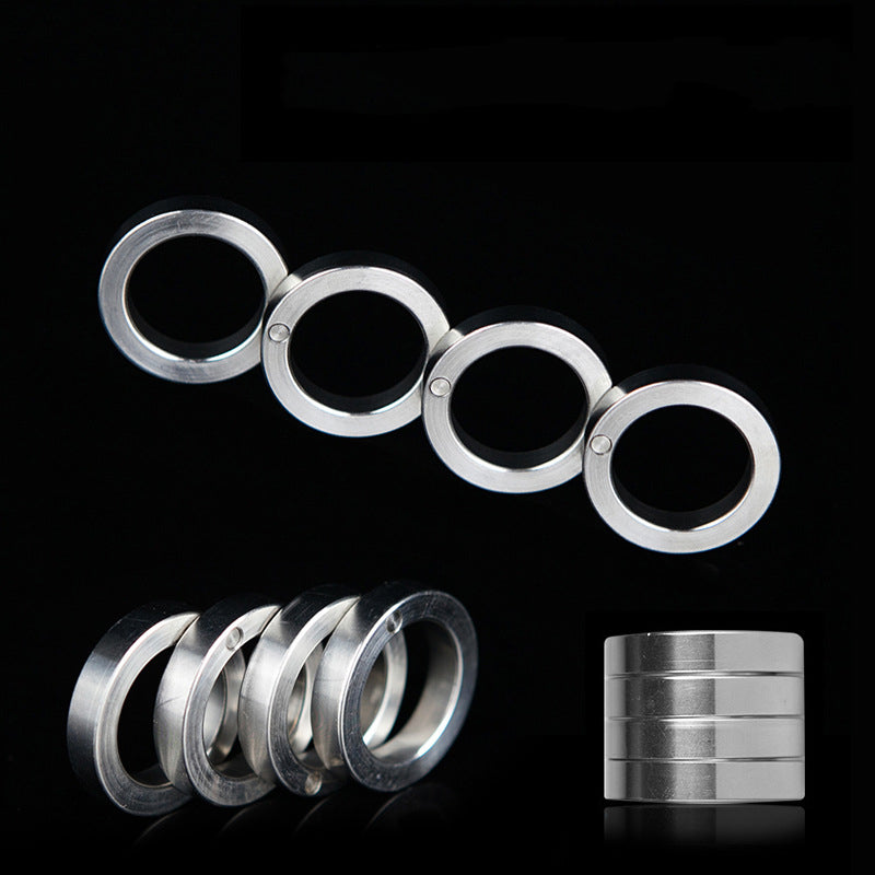 Composite of the stainless steel four-ring knuckle on a black background, unfolded row above, angled stack and folded cylinder below