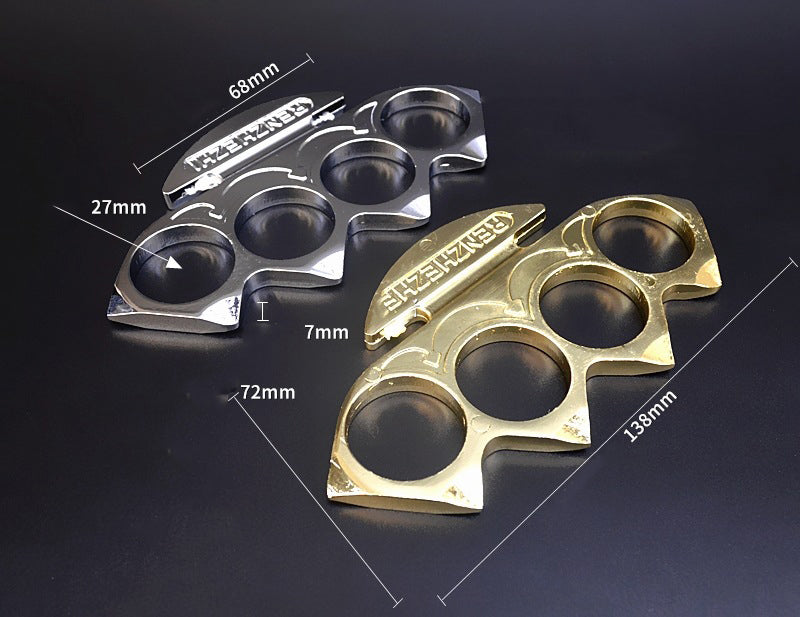 Gold and silver knuckle dusters side by side with dimension marks for the 138mm width and 72mm height