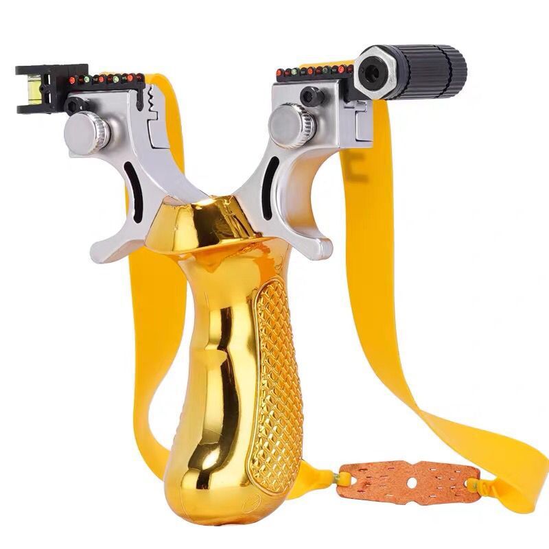 Gold slingshot with yellow bands, showing the reference dots and level module at the fork tips