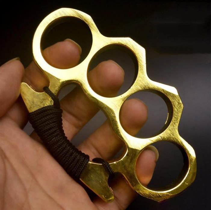 Golden-F aluminum knuckle duster with paracord held in hand