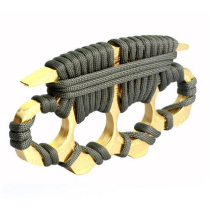 A golden zinc alloy knuckle duster wrapped in olive-green paracord, shown at a slight angle on a plain white background.