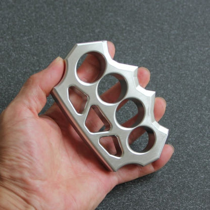 Another hand-held angle of the grass shaped stainless steel knuckle duster.