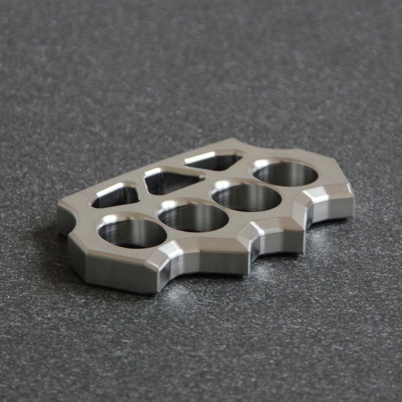 Reverse angled flat lay of the grass shaped stainless steel duster.