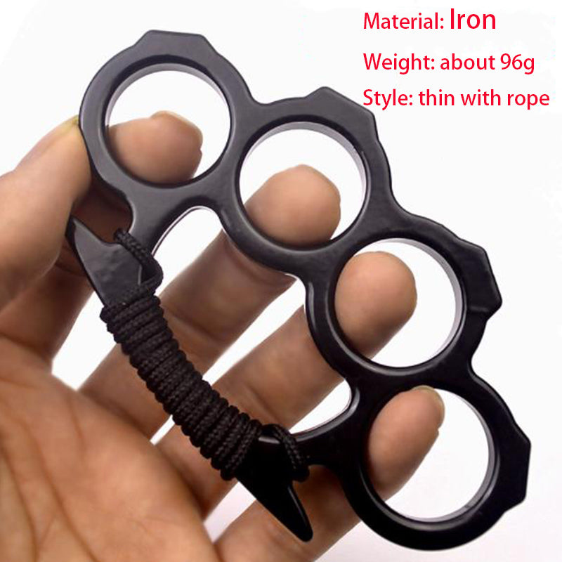 Black thin iron knuckle duster with black rope wrapped around the grip, held in a hand