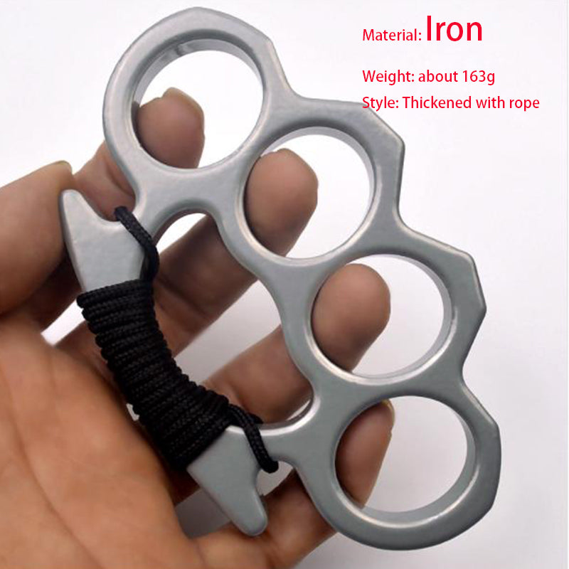 Silver thickened iron knuckle duster with black paracord wrapped around the lower grip, held in a hand