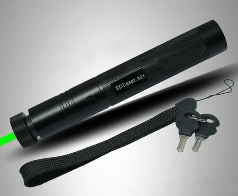 Black laser pen angled forward with a green beam at the front and a wrist strap with keys alongside