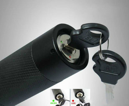 Close-up of the laser pen tail cap with the key inserted between the locked and open positions