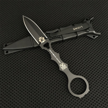 Close-up of the black Liome 176 skeleton knife lying across its molded sheath
