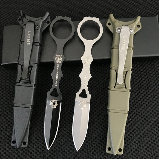 Liome 176 fixed-blade knives in black and silver with matching nylon sheaths arranged on black mesh