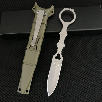 Close-up of the silver Liome 176 skeleton knife with its tan nylon sheath