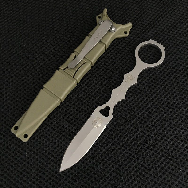 Silver Liome 176 skeleton fixed-blade knife beside its matching tan nylon sheath on mesh