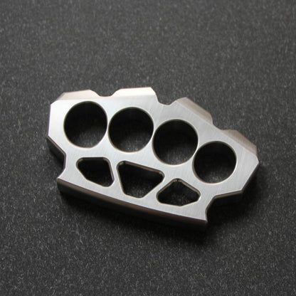 304 stainless steel maple leaf shaped knuckle duster with four round finger holes on a dark textured surface.