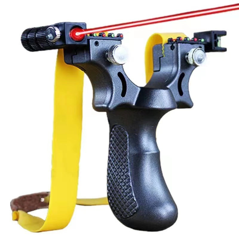 Matte black slingshot with yellow bands and the laser dot lit, red beam crossing above the fork