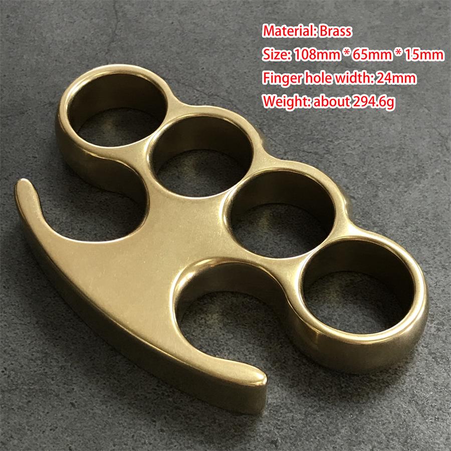 Medium brass knuckle duster front view, four round holes and claw tips, with size markings overlaid in red