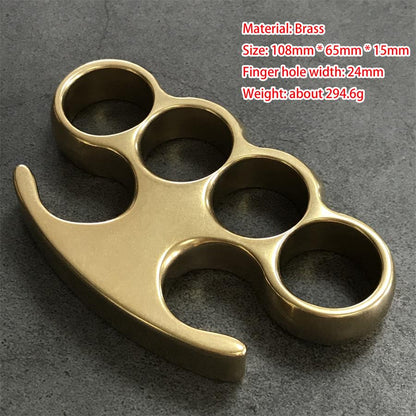Medium brass knuckle duster front view, four round holes and claw tips, with size markings overlaid in red