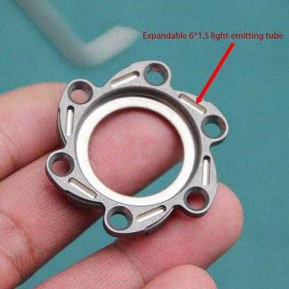 Close detail of the brushed finish and chamfered edges on the metal stress relief toy surface