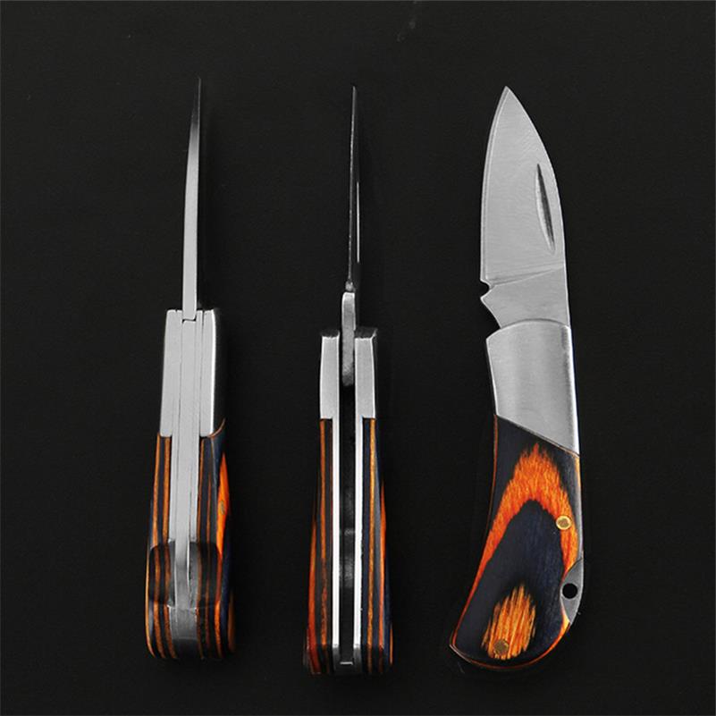 Three views of the mini folding knife on a black background - closed from the back, closed edge-on, and open from the side - showing the layered steel spine, the navy-and-orange wood scales and the drop-point blade.