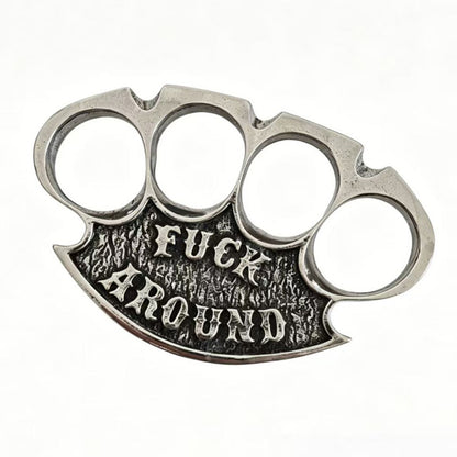 Silver chrome retro knuckle duster top view with raised lettering on a white background