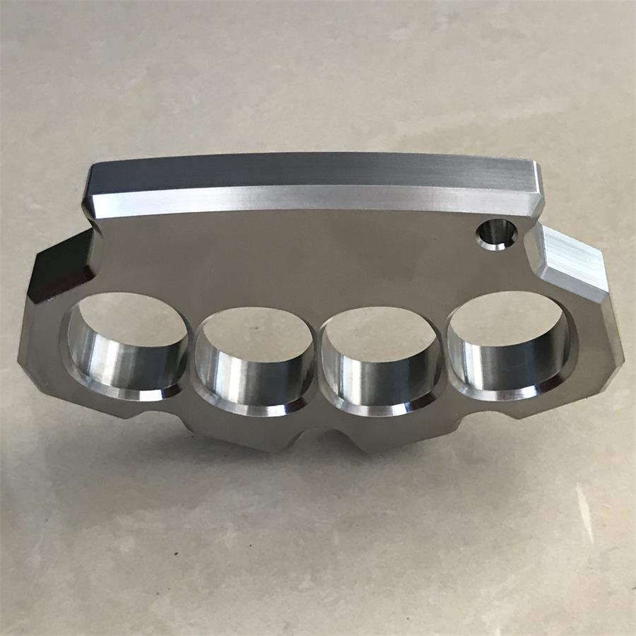 Rear view of the mirror polished four-hole stainless steel duster standing on its edge.