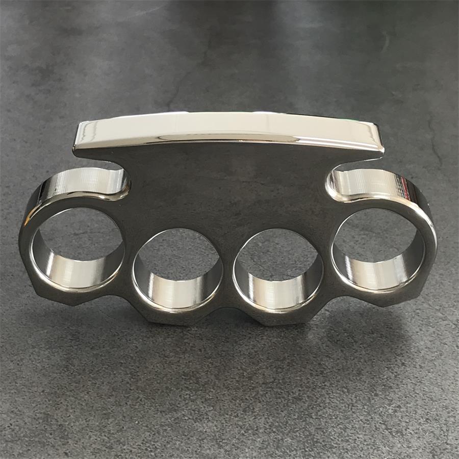 Standing front view showing the stepped top edge and chamfered facets above the four finger holes