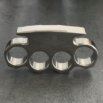 Standing front view showing the stepped top edge and chamfered facets above the four finger holes