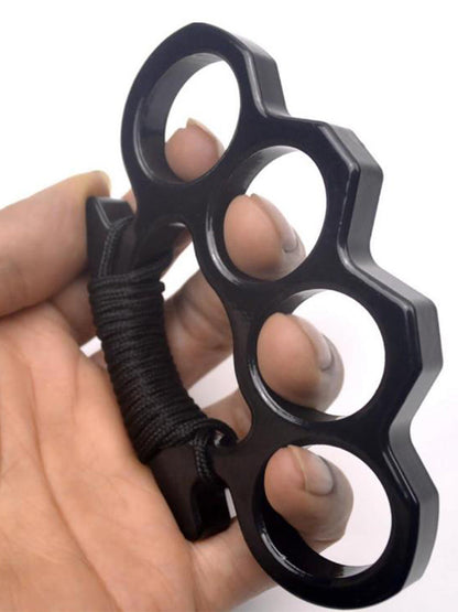 Black knuckle duster side view held in hand with window breaker detail